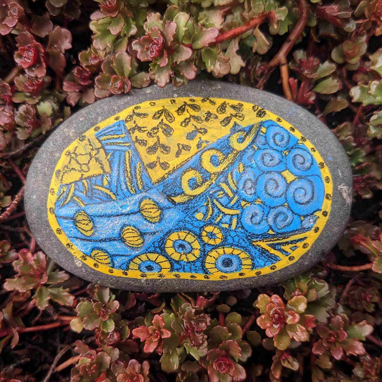 Blue and yellow illustration on stone