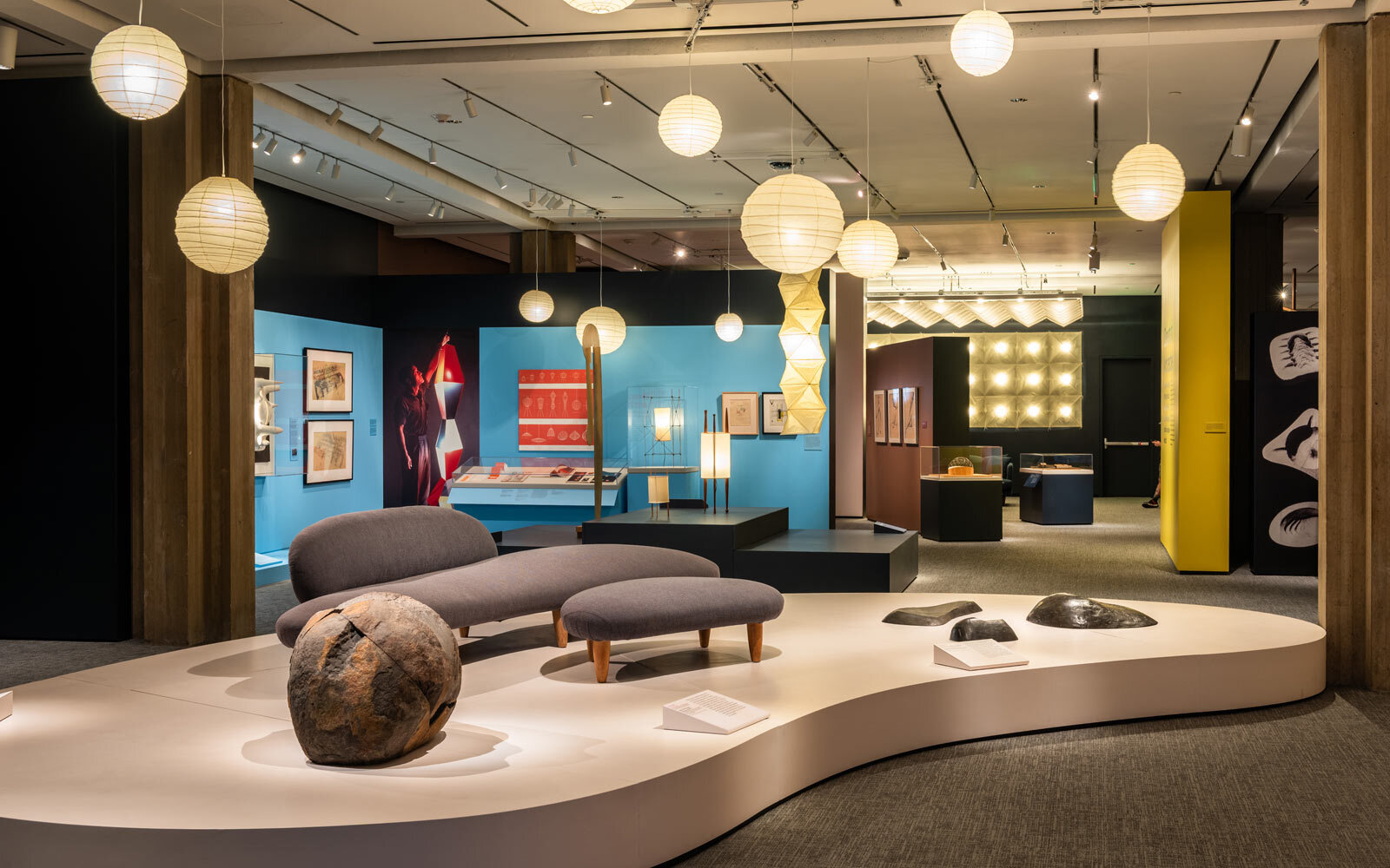 Display of modern couch and Akari lights by Noguchi