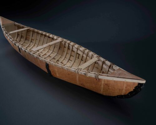John Ferris (Constance Lake First Nation), Birchbark Canoe, 2022. Birchbark, rawhide, spruce root. On loan from the artist. Photo by James Kegley.
