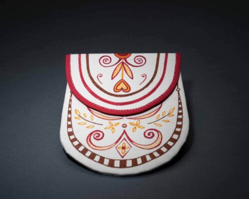 Margaret Orr (Cree, Chisasibi First Nation), Painted pouch, 2022. Canvas, natural dyes. On loan from the artist. Photo by James Kegley.
