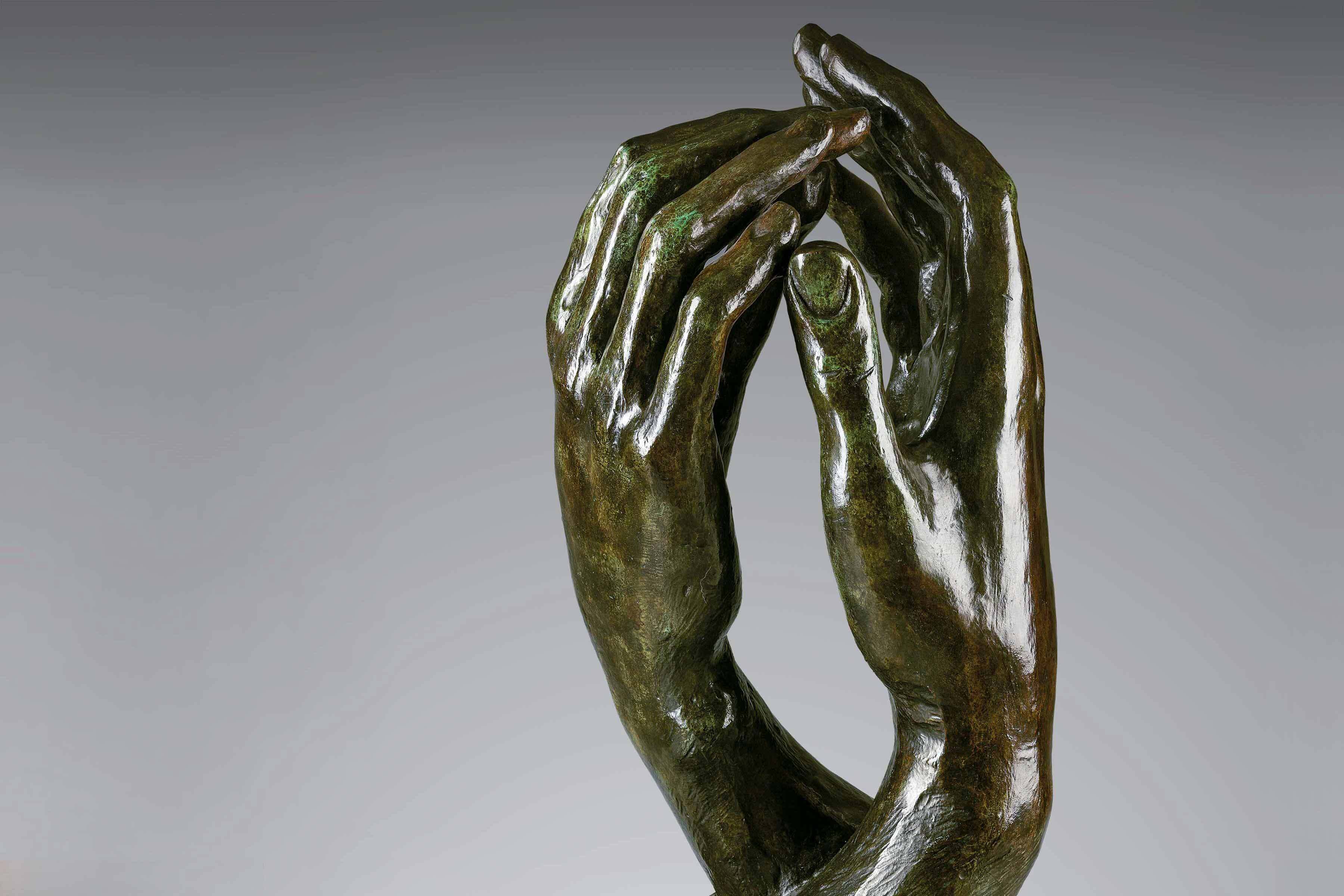 Detail of bronze hands sculpture