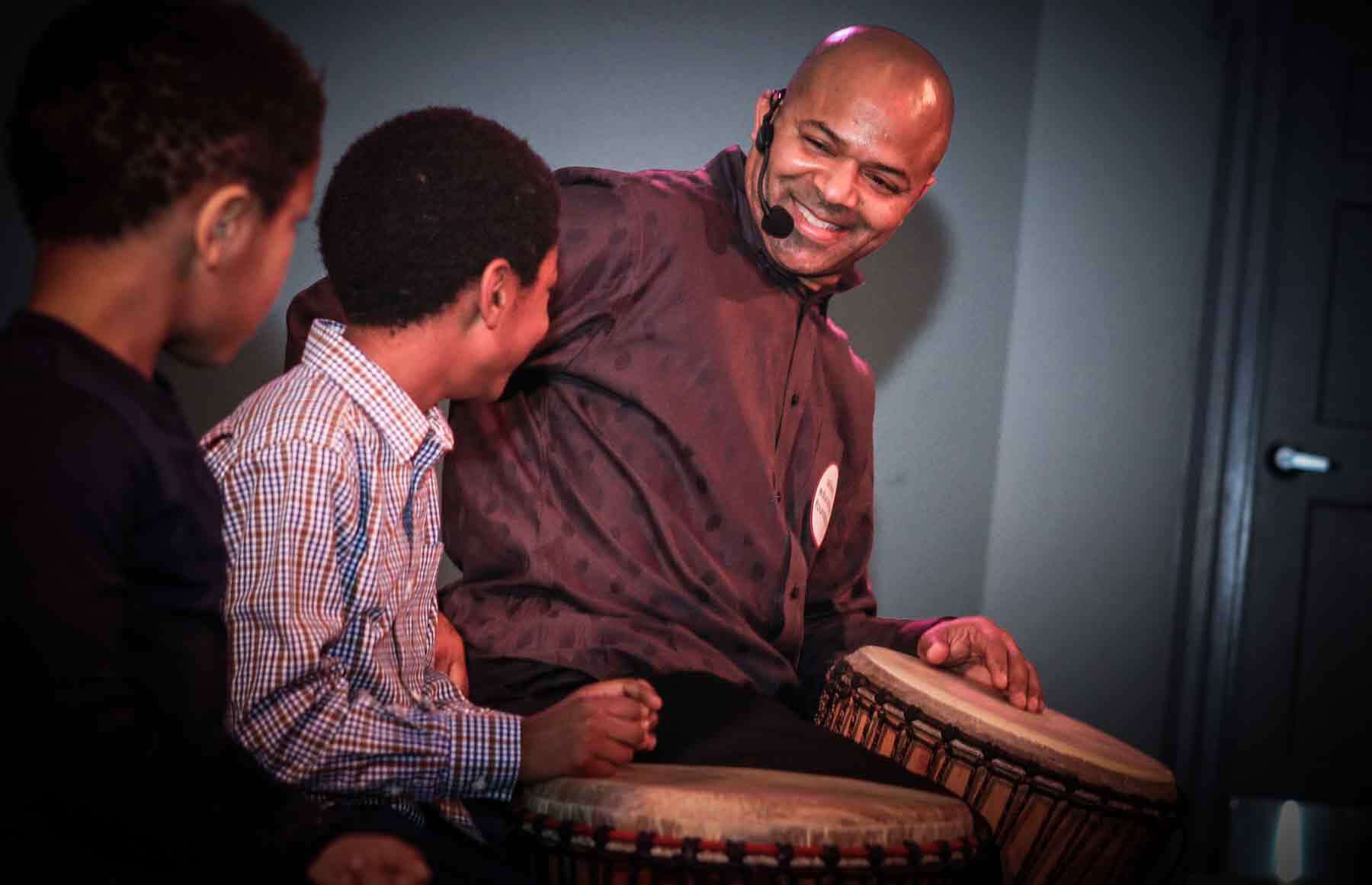 Greg Coles drumming with teens