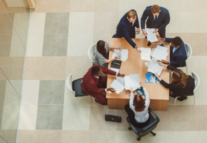 Photo of 7 people working around a table