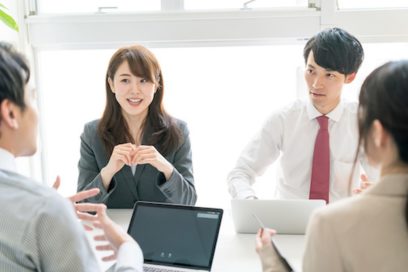 Image of two Asian employees in an office