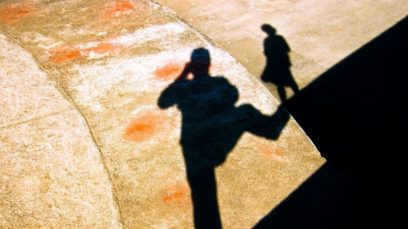 Photo of a large male shadow and small woman shadow