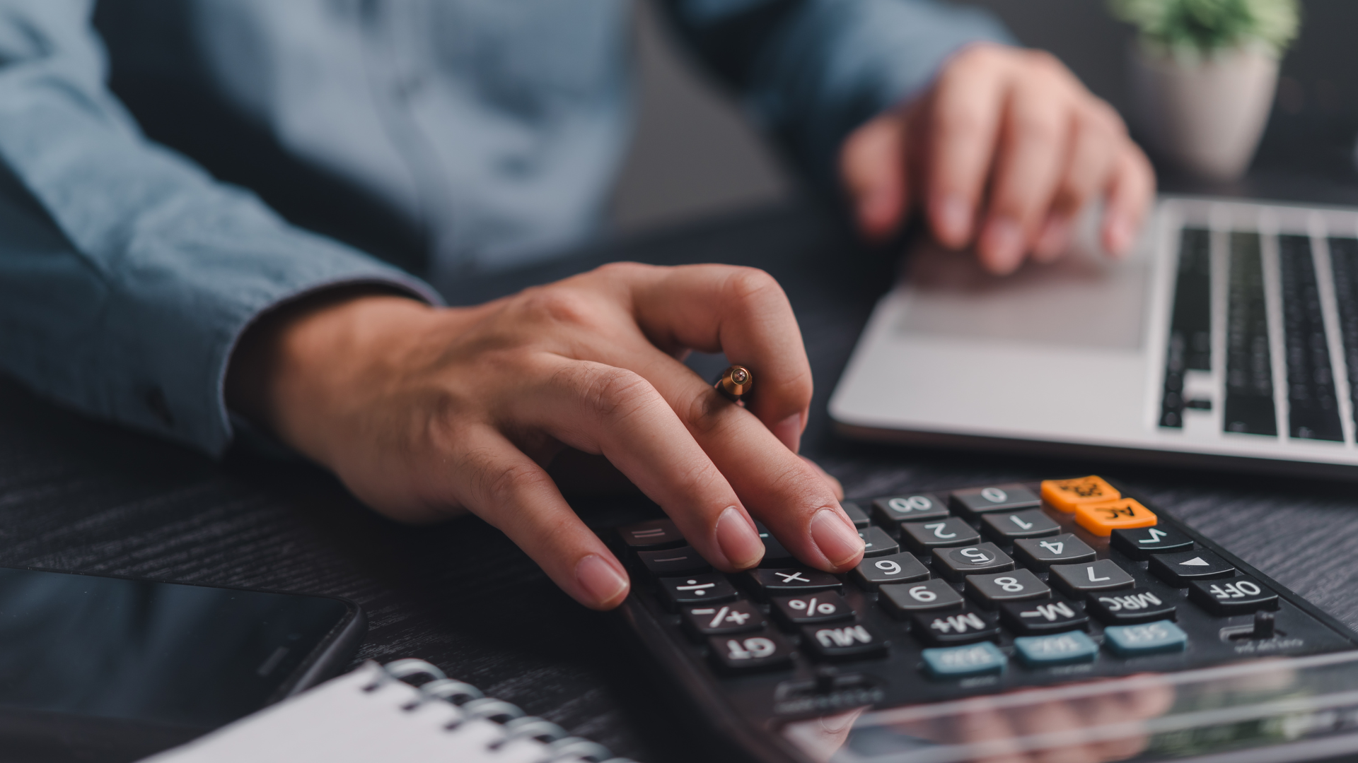A person using a calculator