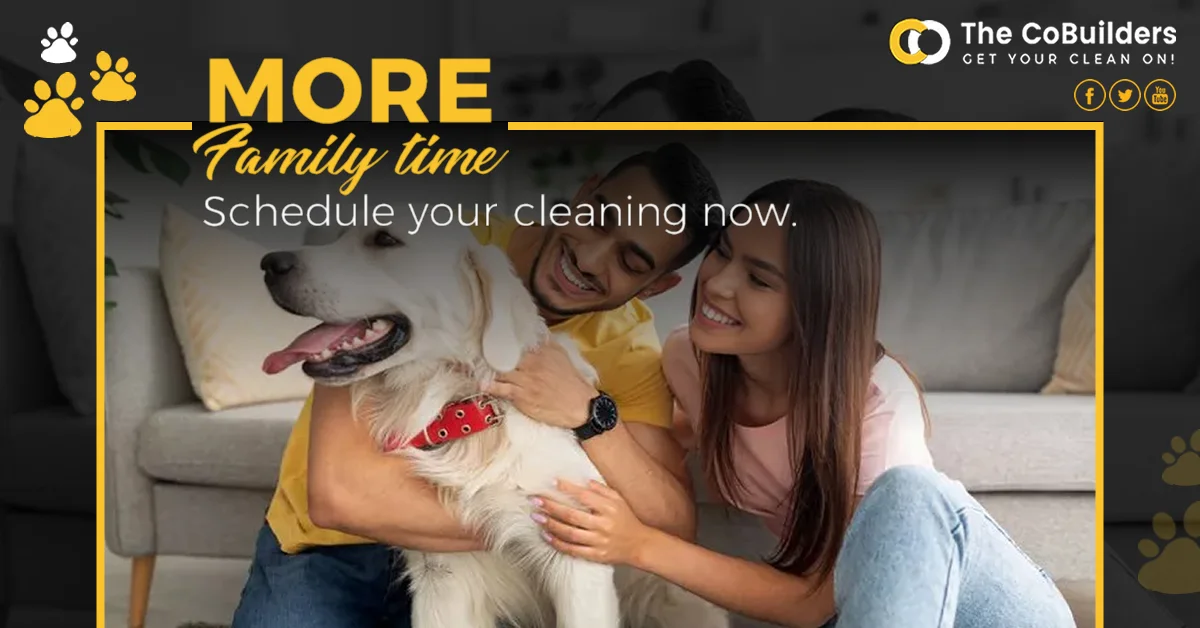 a happy couple sitting in front of a couch with arms around their white dog