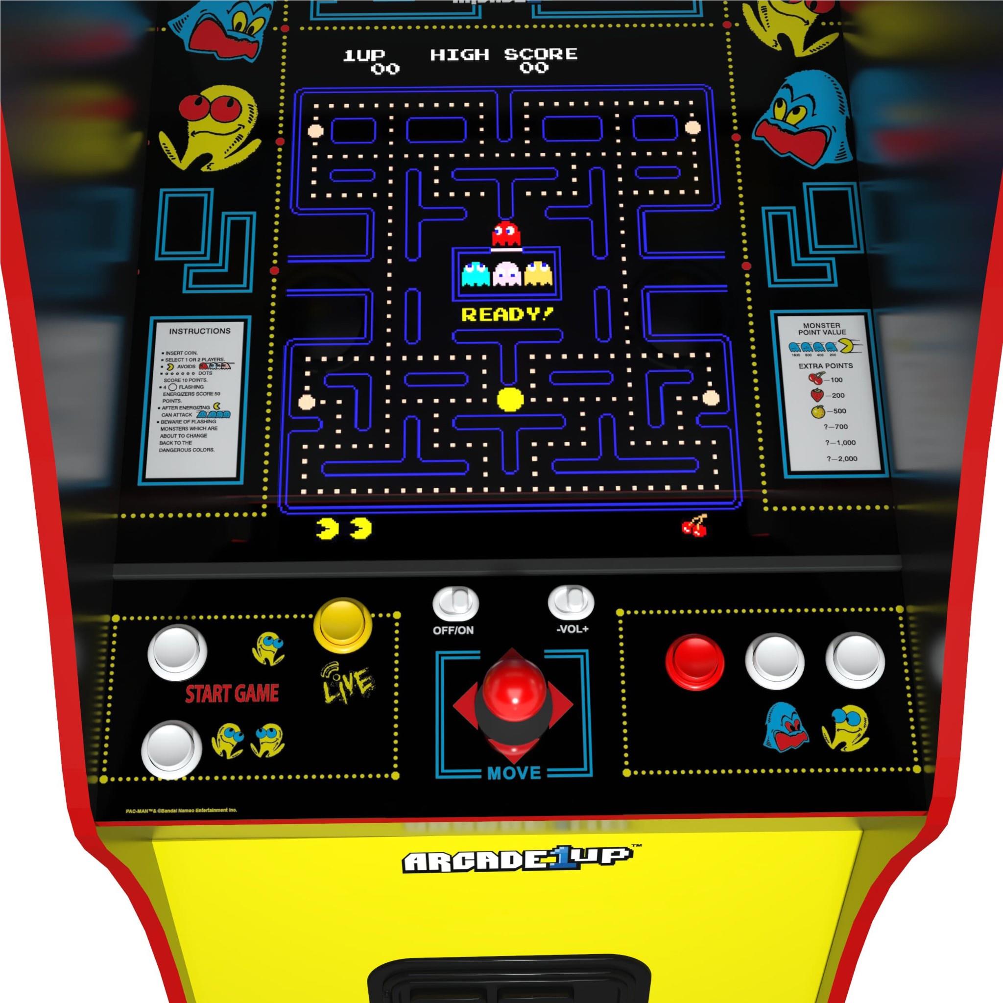 Close-up of a vintage Pac-Man arcade game with glowing screen
