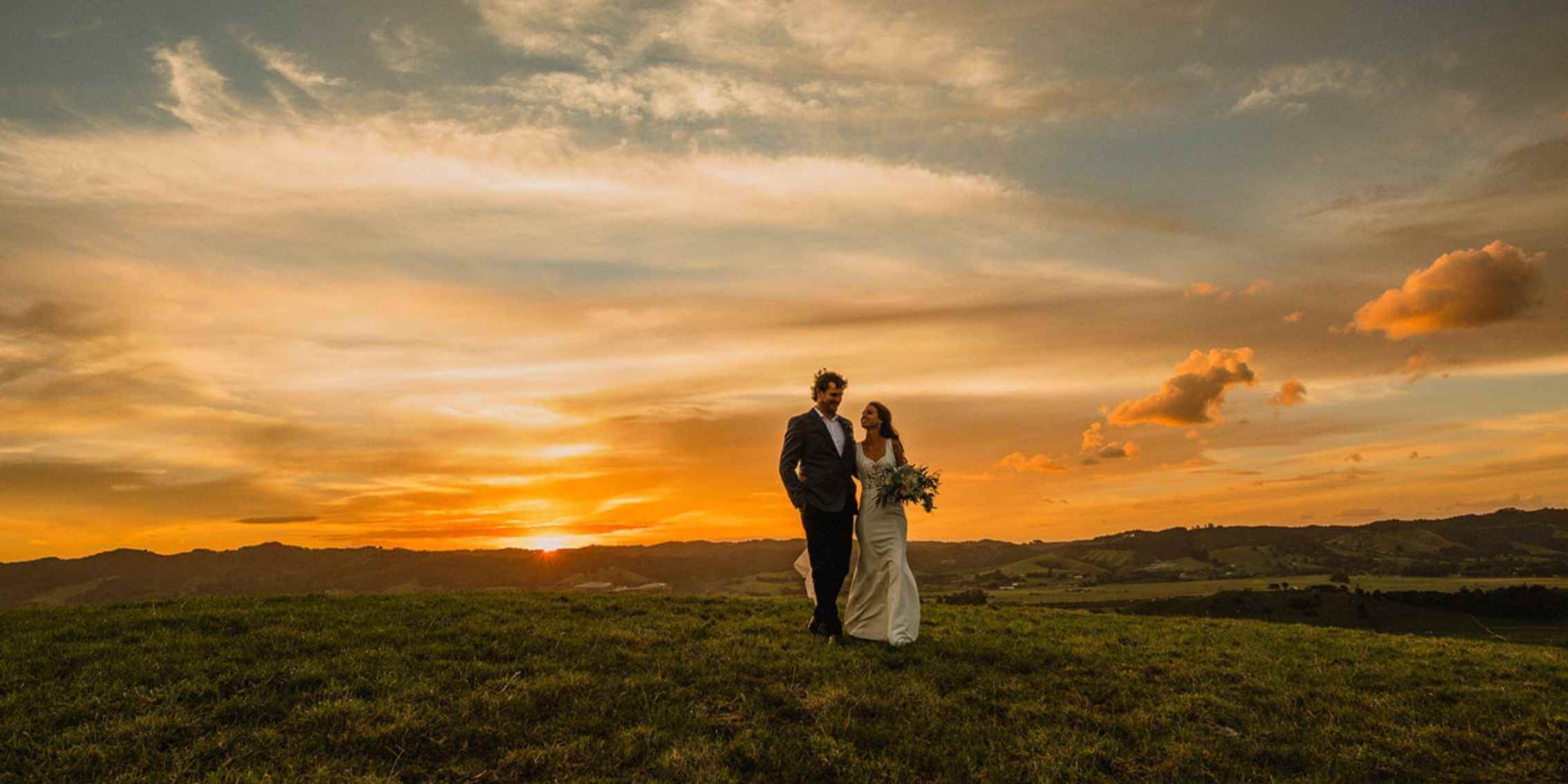 A
Guide to Choosing Between sRGB and Adobe RGB – Capturing Colour Depth in
Photography A warm-toned wedding portrait of a couple walking on a hill at
sunset, showcasing rich colours and dynamic range in photography.