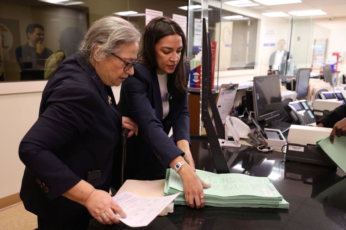 Alexandria submitting petition signatures.