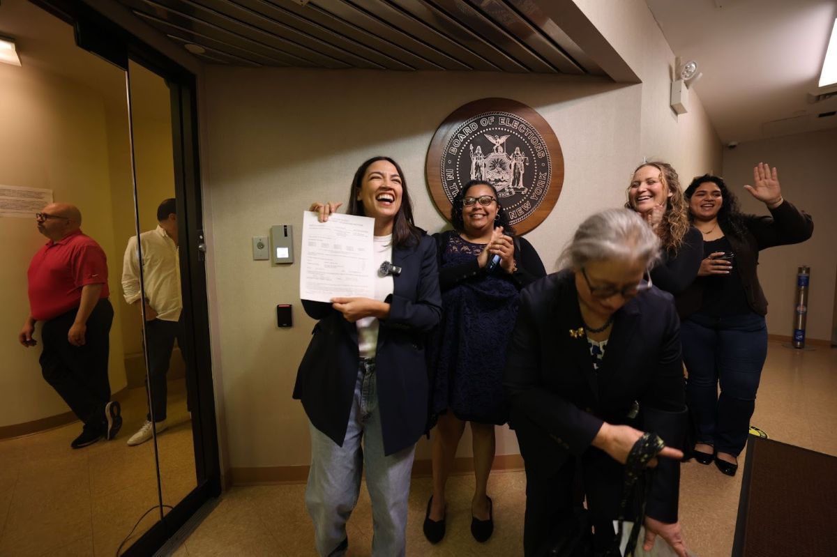 Alexandria and Team AOC submitting petition signatures.