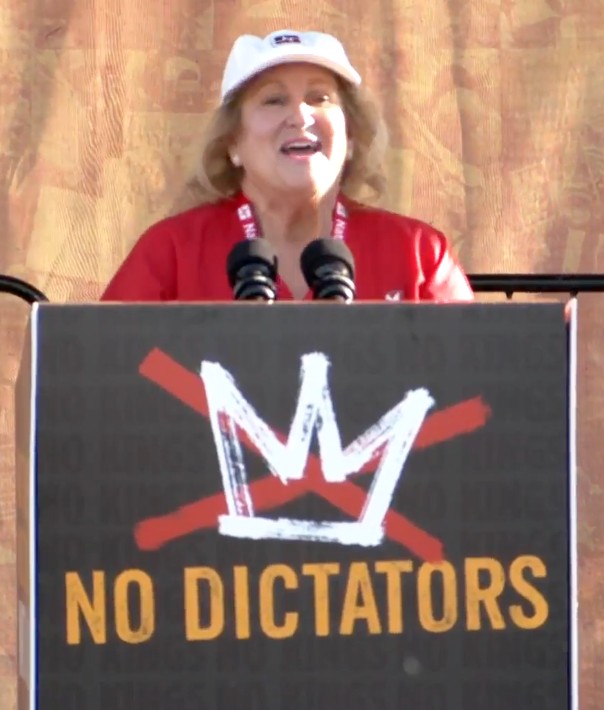 Photo of Sandy Reding, RN and CNA/NNOC President, speaking to the No Kings San Francisco crowd