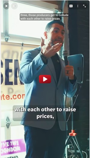 Abdul El-Sayed campaigning at a rally for breaking up monopolies.