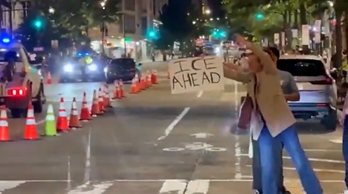 Protestors warn of ICE roadblock.