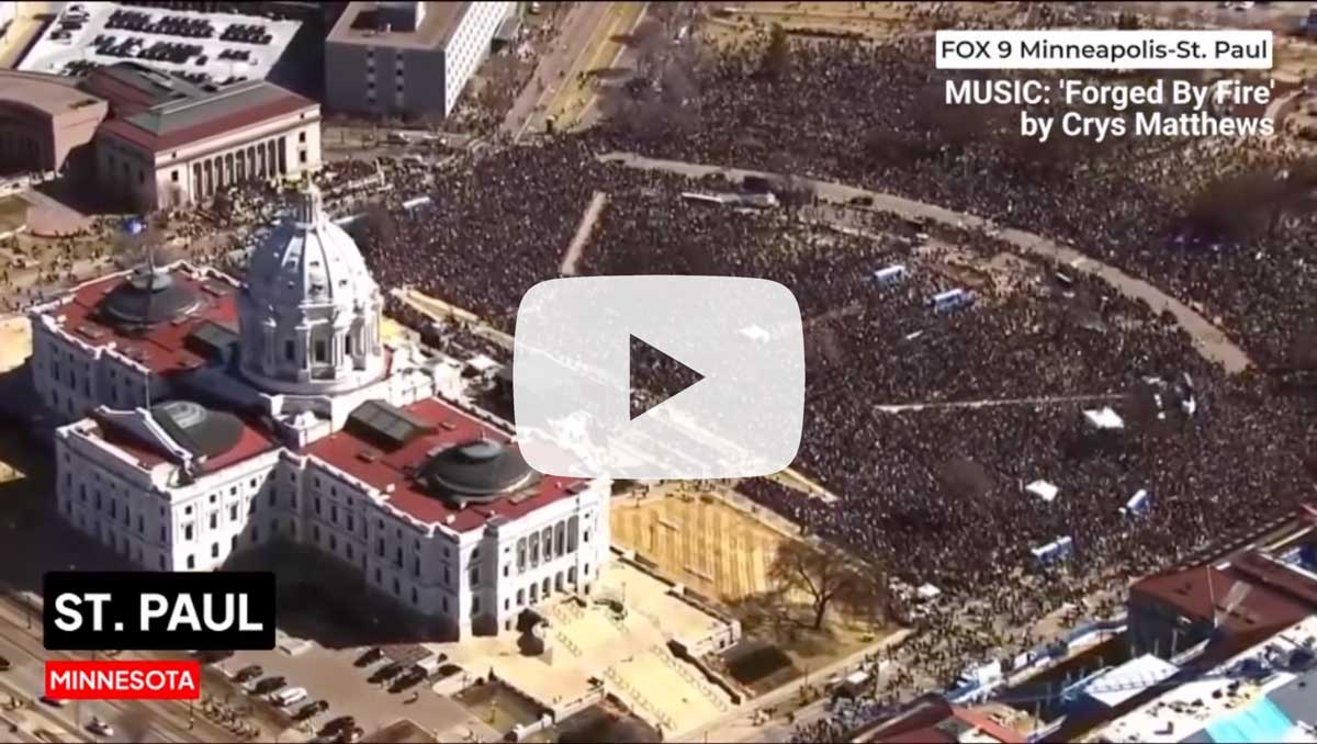 a snapshot of the No Kings wrap up video with a play button on it