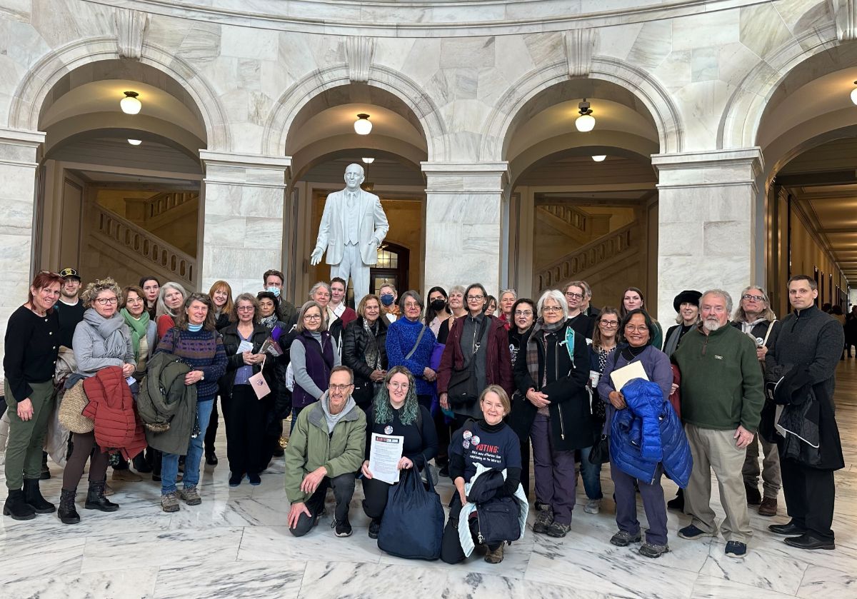 Members of six Virginia Indivisible groups pose in the Capitol's rotunda