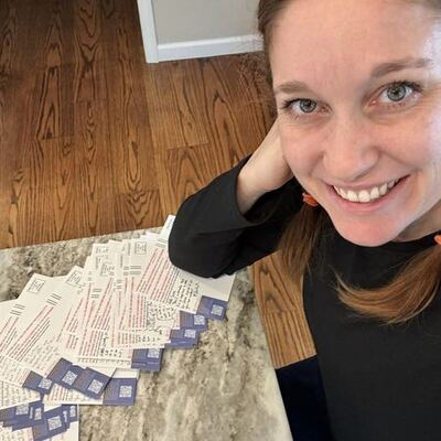 A MomsRising volunteer with handwritten postcards