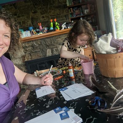 A MomsRising volunteer with handwritten postcards