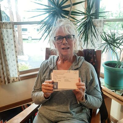 A MomsRising volunteer with handwritten postcards