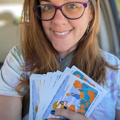 A MomsRising volunteer with handwritten postcards