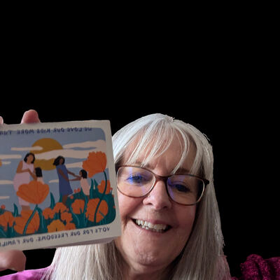 A MomsRising volunteer with handwritten postcards