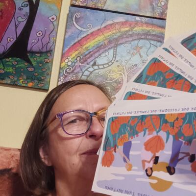 A MomsRising volunteer with handwritten postcards