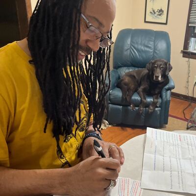 A MomsRising volunteer with handwritten postcards
