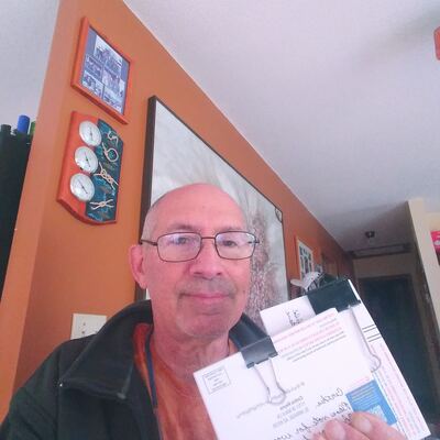 A MomsRising volunteer with handwritten postcards