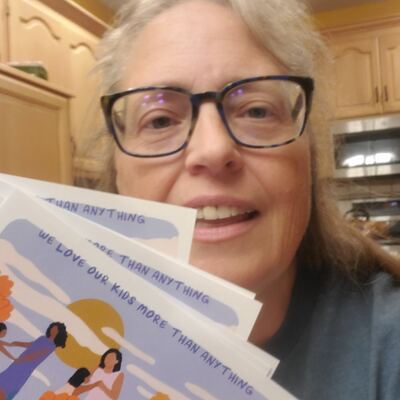 A MomsRising volunteer with handwritten postcards