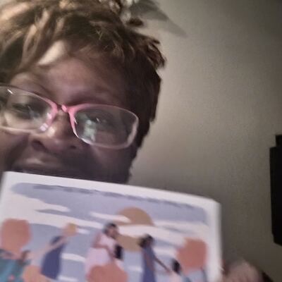 A MomsRising volunteer with handwritten postcards