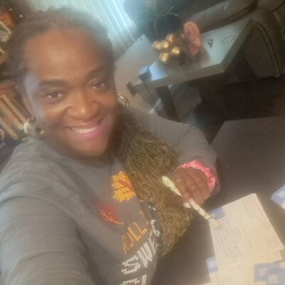 A MomsRising volunteer with handwritten postcards