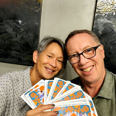 A MomsRising volunteer with handwritten postcards