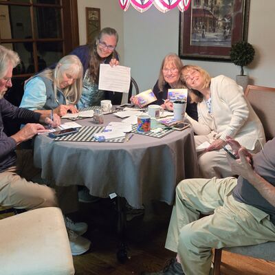 A MomsRising volunteer with handwritten postcards