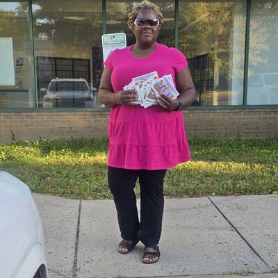 A MomsRising volunteer with handwritten postcards