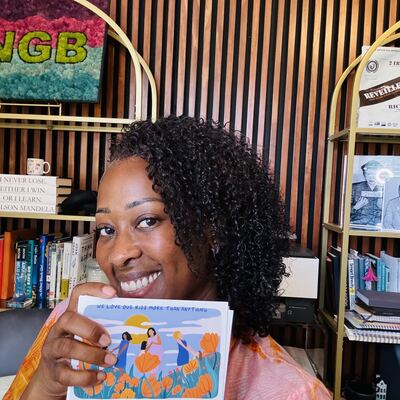 A MomsRising volunteer with handwritten postcards