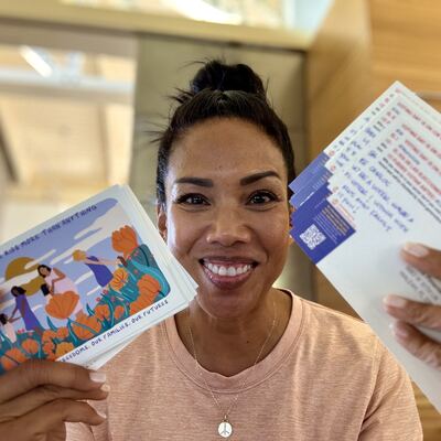 A MomsRising volunteer with handwritten postcards