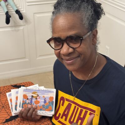 A MomsRising volunteer with handwritten postcards