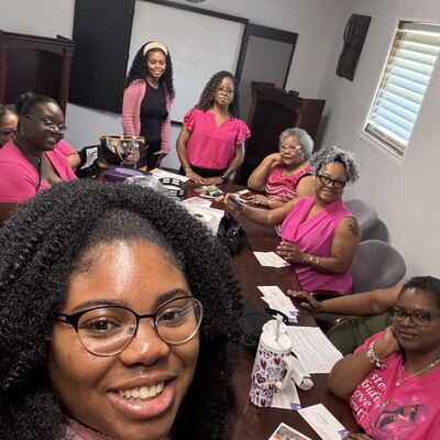 A MomsRising volunteer with handwritten postcards