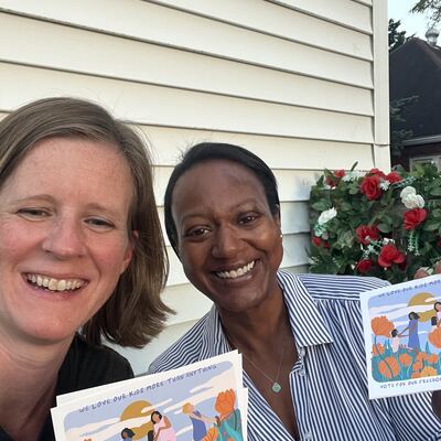 A MomsRising volunteer with handwritten postcards