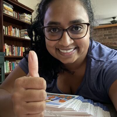 A MomsRising volunteer with handwritten postcards