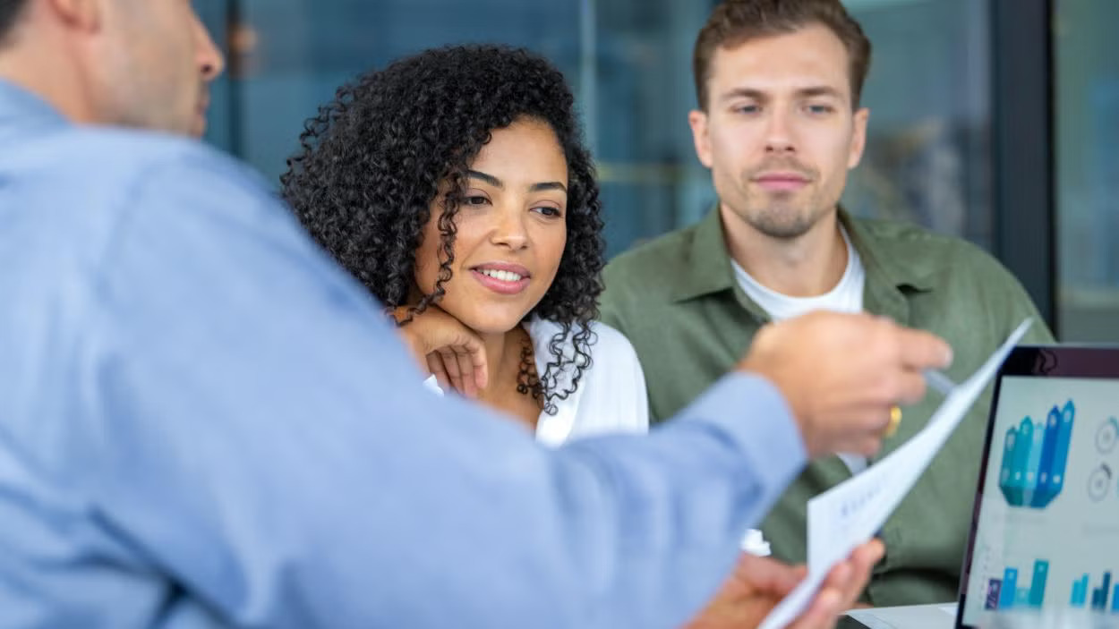 people looking at paperwork