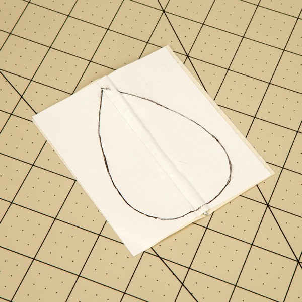 Cut the square with wire from the previous step into a teardrop shape