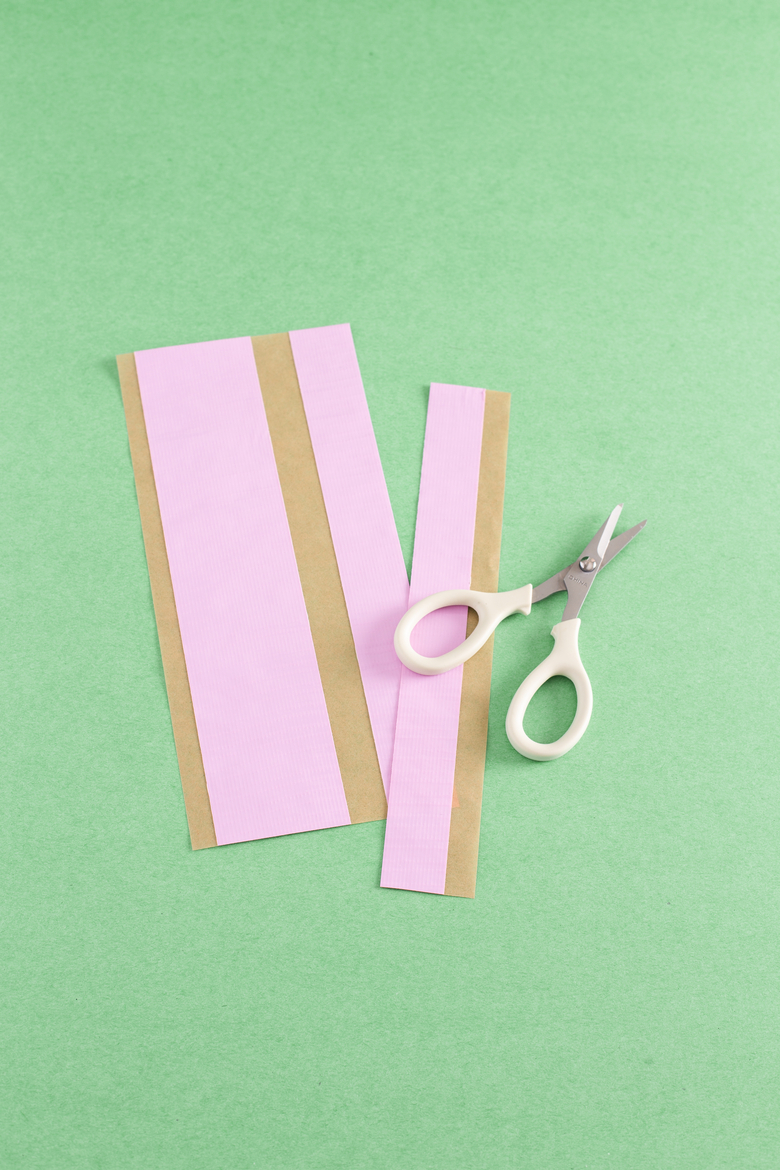 Strips of tape cut to mathc the length of your box, then cut length wise to create 1 inch wide strips