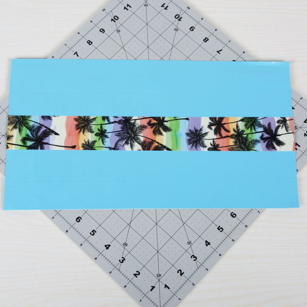 Design strip of Tape affixed to the center of the fabric