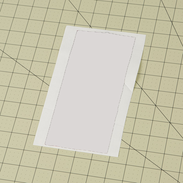 two strips of Duck Tape placed on wax paper to make a fabric