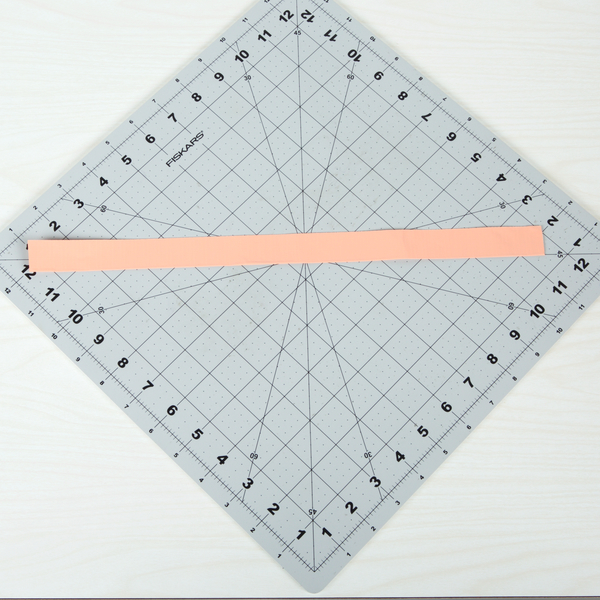 long and thin double sided strip of Duck Tape made by folding a strip of Duck Tape length wise
