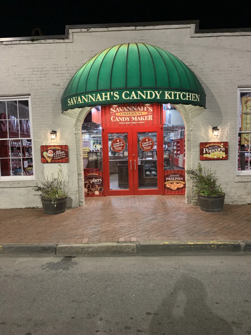 Savannah's Candy Kitchen storefront with window, door, and wall signage.
