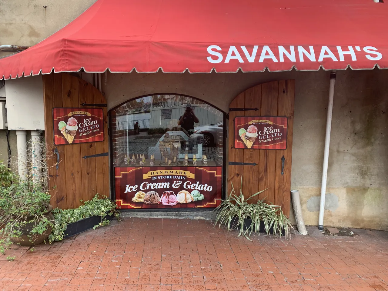 Savannah's ice cream shop with door and window graphics applied to the glass.