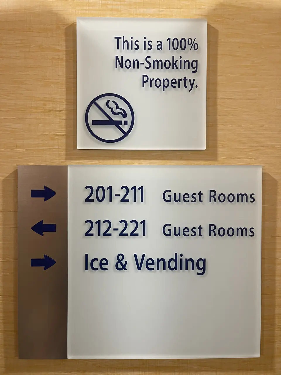 Plastic hotel room placards arranged on a surface before installation.