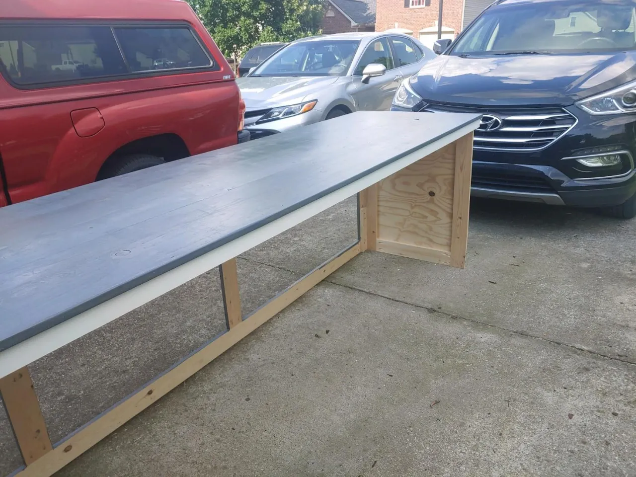 Initial desk build with wood structure and top laminate being assembled in the shop prior to graphics installation.